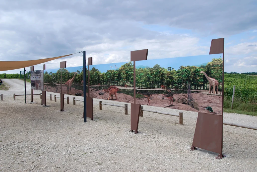 Explanatory panels on the palaeontological site of Angeac Charente, with images of dinosaurs and flora on the site