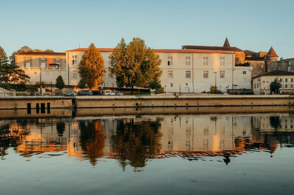 The facade of Château de Cognac with the Charente in the foreground