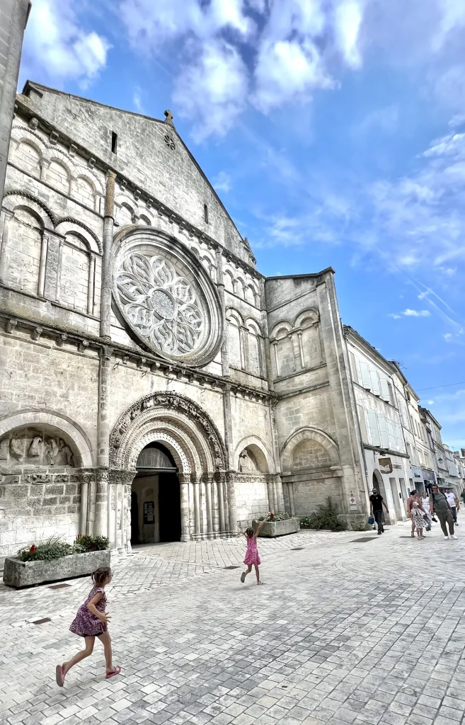 The facade of the church of Saint Léger in Cognac, with the earth's work and the signs of the zodiac depicted on the arch
