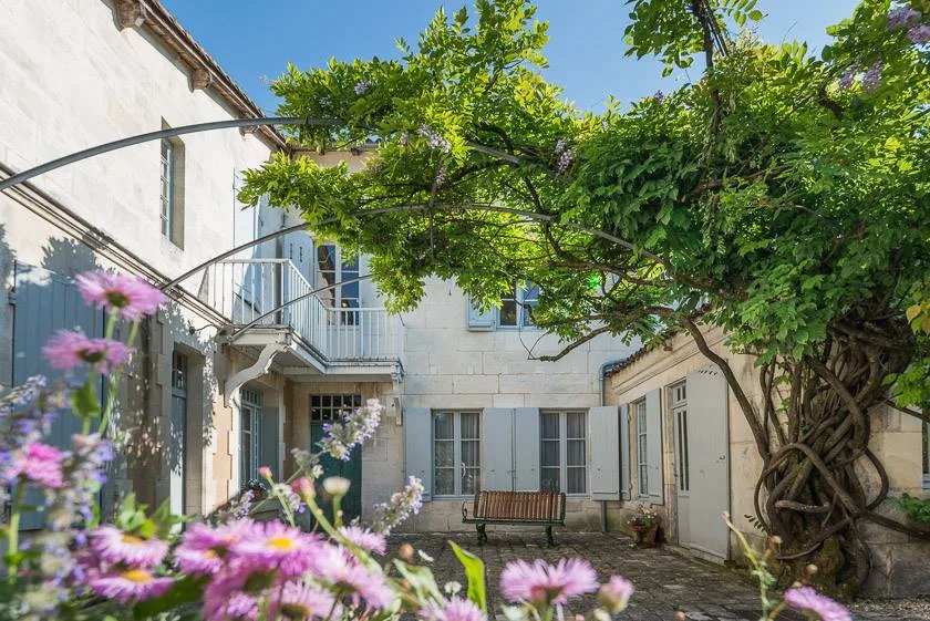 Childhood home of François Mitterrand in Jarnac, seen from the garden with the wisteria in bloom
