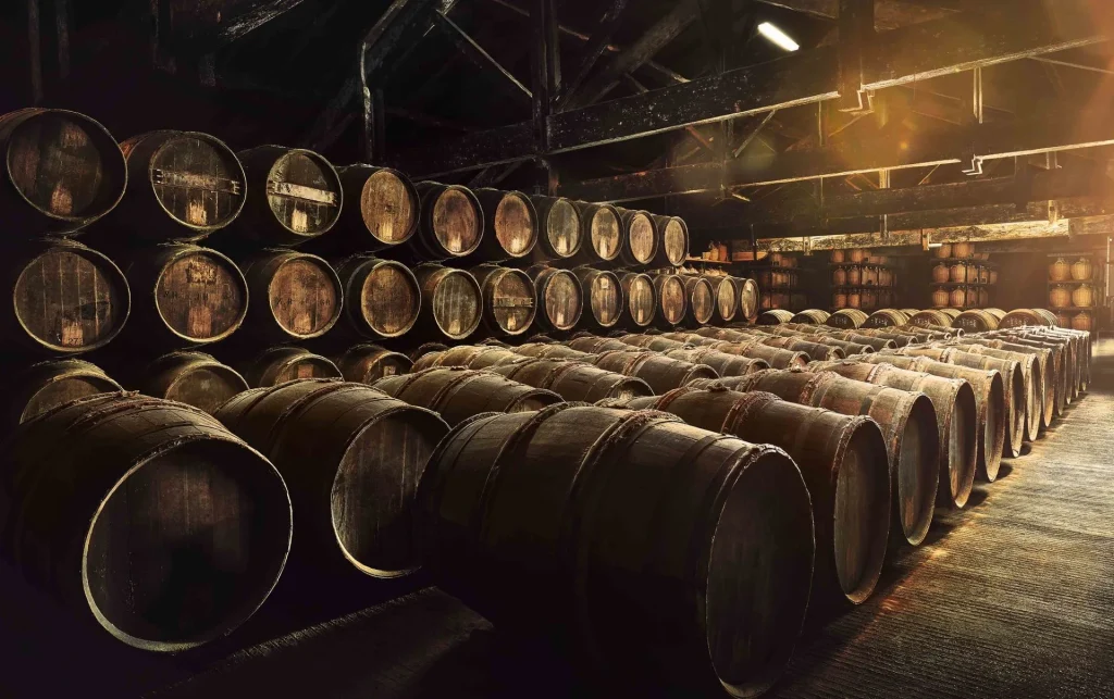 barrels, casks and barrels where cognac brandy is aged in the cellar of the founder of the hennessy trading house in Cognac