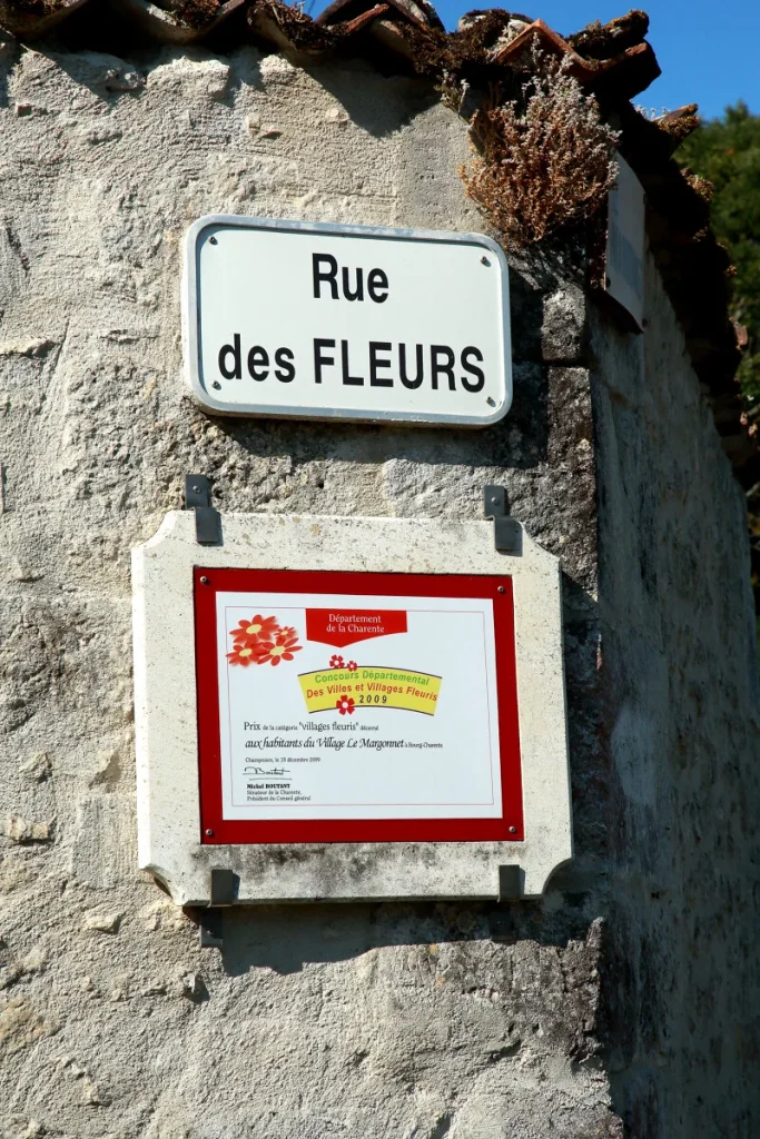 Signs for the Rue des Fleurs in the hamlet of Margonnet in Bourg Charente
