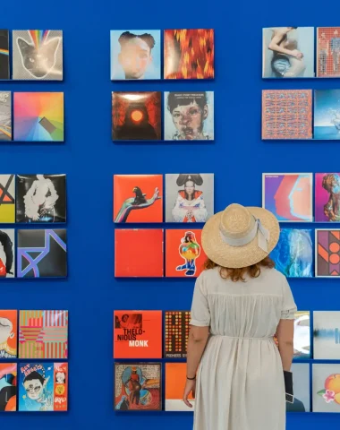 Young woman in front of a Mart Foundation exhibition