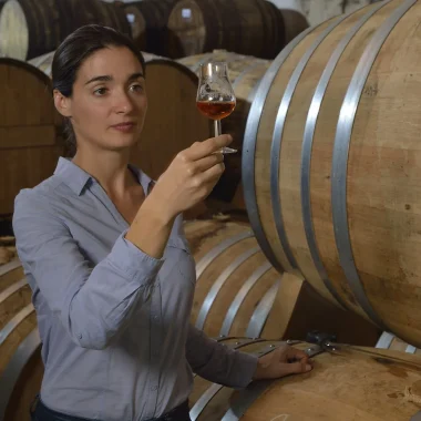 Mélissa Prulho in a cellar ageing eaux-de-vie from Prulho cognac